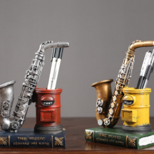 VINTAGE FIGURE SAXOPHONE ON BOOK & PEN HOLDER RESIN MATERIAL